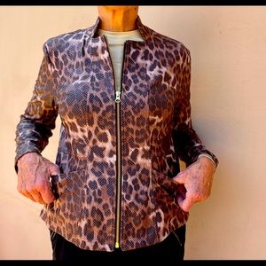 Faux leather. Zip front. 95% poly 5% spandex. Hand wash. Fits 8-10.